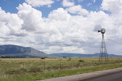 Scenic view of landscape against cloudy sky