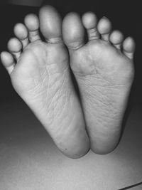 Low section of baby feet