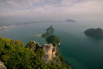 High angle view of rocks on sea against sky