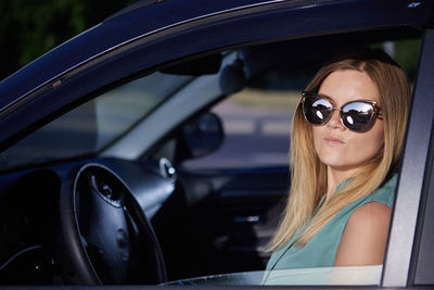 Portrait of woman in car