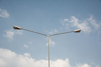 Low angle view of street light against sky