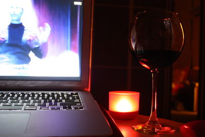 Close-up of wine glasses on table