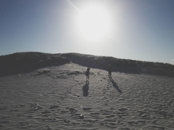 Scenic view of beach on sunny day