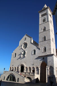 Low angle view of building against clear blue sky