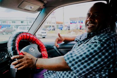 Portrait of man and woman in car