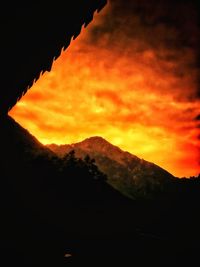 Scenic view of silhouette mountain against sky during sunset