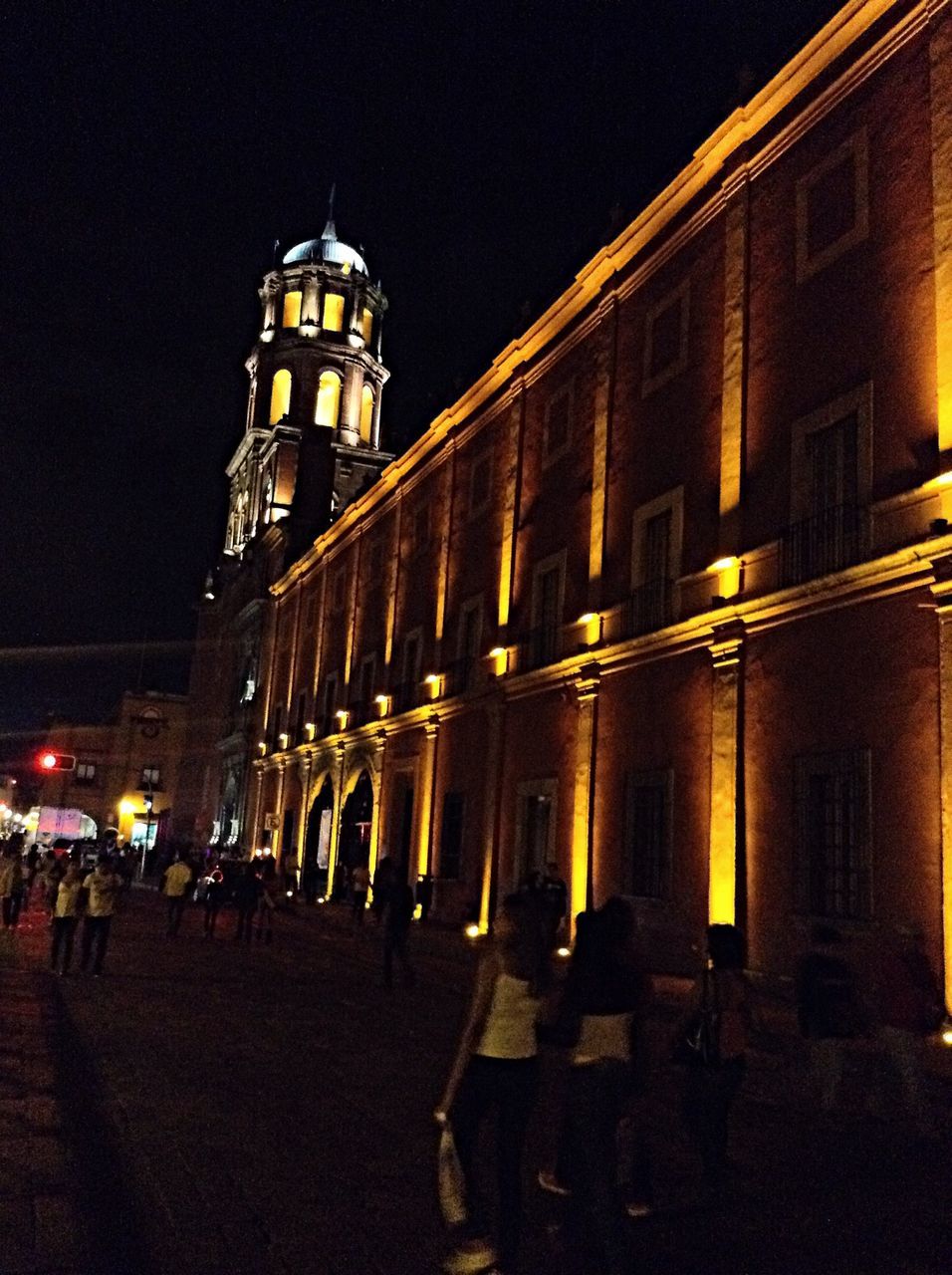 architecture, building exterior, built structure, illuminated, night, city, street light, low angle view, lighting equipment, sky, clear sky, building, city life, travel destinations, facade, street, famous place, outdoors, tower