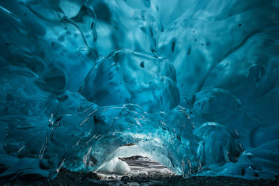 Blue glacial ice cave at mendenhall glacier