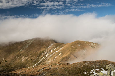 Scenic view of volcanic mountain against sky