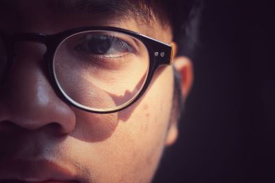 Close-up portrait of man wearing eyeglasses