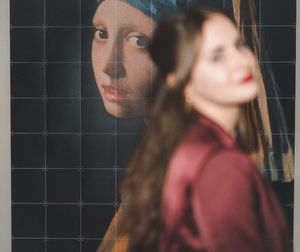 Portrait of young woman looking at camera