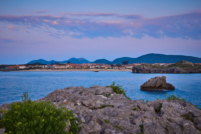 Scenic view of sea against blue sky