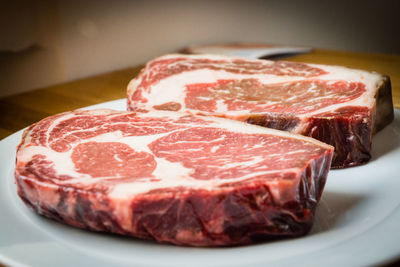 Close-up of meat in plate on table