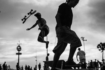 Silhouette of woman against sky