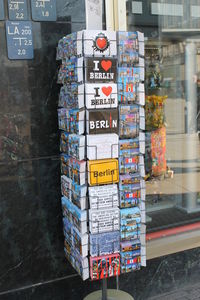 Books arranged on shelf at store for sale