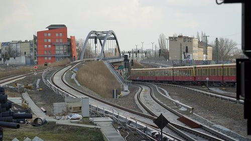 High angle view of train in city against sky