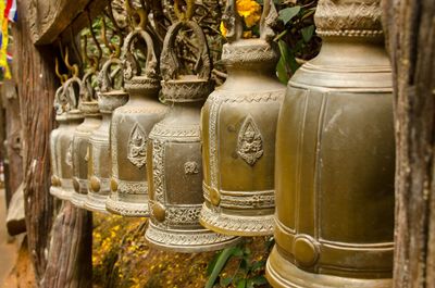 Close-up of old bells hanging at khao khitchakut national park