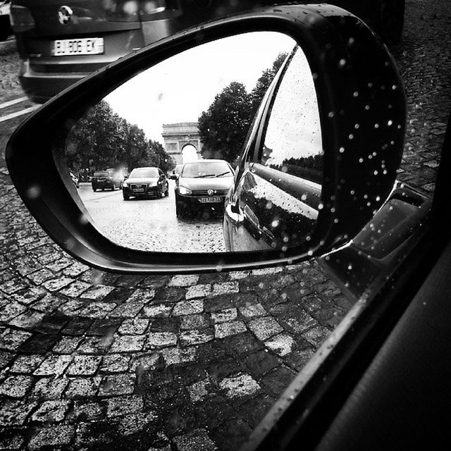 transportation, mode of transport, land vehicle, car, street, reflection, road, side-view mirror, glass - material, stationary, travel, no people, window, vehicle interior, day, close-up, outdoors, city, tree, headlight