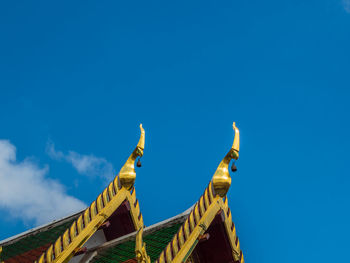 Low angle view of built structure against blue sky