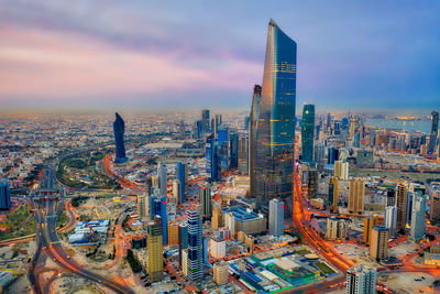 Aerial view of city buildings during sunset