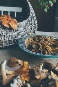 Basket with edible mushrooms  in  forest