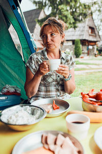 Young woman with coffee cup