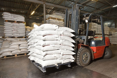 Forklift in a warehouse with wheat in sacks