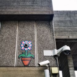 Low angle view of painting on wall of building