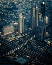 High angle view of skyscrapers by roads in city