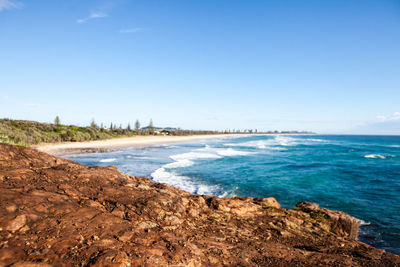 Scenic view of sea against clear blue sky