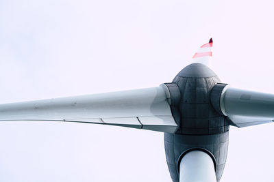 Low angle view of airplane flying against clear sky