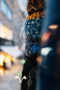 Rear view of woman sitting in bus during winter