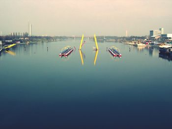 Boats in sea against sky