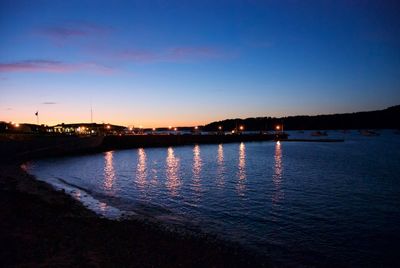 Reflection of illuminated sky on water at sunset