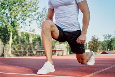 Low section of man running at park