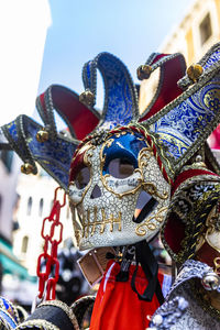 Close-up of costume hanging against sky