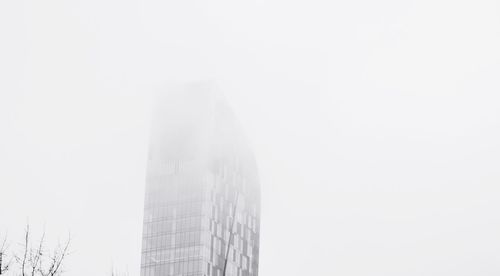 Low angle view of skyscraper against clear sky