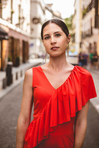 Portrait of beautiful young woman standing outdoors