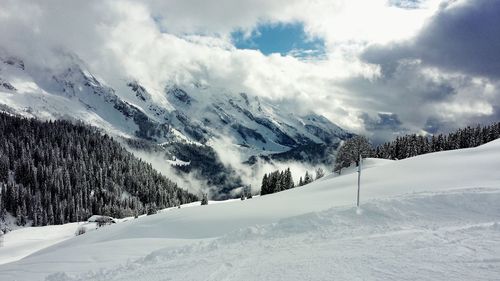 Scenic view of snow covered mountains