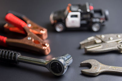 Close-up of work tools on black background