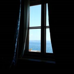 View of sea through window