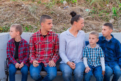 Portrait of family standing on field