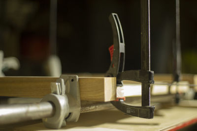 Fixing board with holder. holder for fastening layer. details of tool in workshop. joinery.