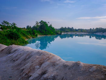 Scenic view of lake by trees against sky in bangka island, indonesia