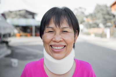 Portrait of woman wearing cervical neck collar