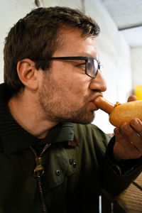 Close-up of man eating food