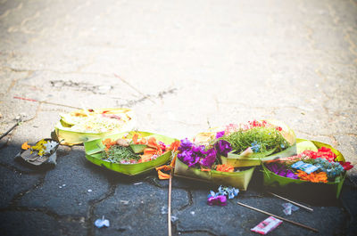 High angle view of religious offering on road