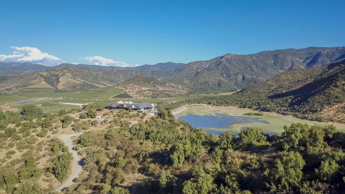 Scenic view of mountains against blue sky