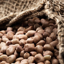 Close-up of peanuts in jute sack