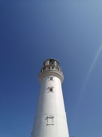 Low angle view of lighthouse against sky